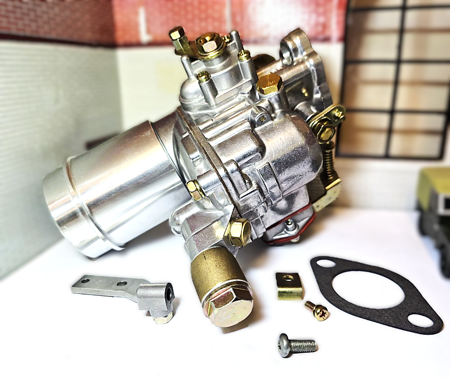 Carburetor and its components on a white surface with a blurred background
