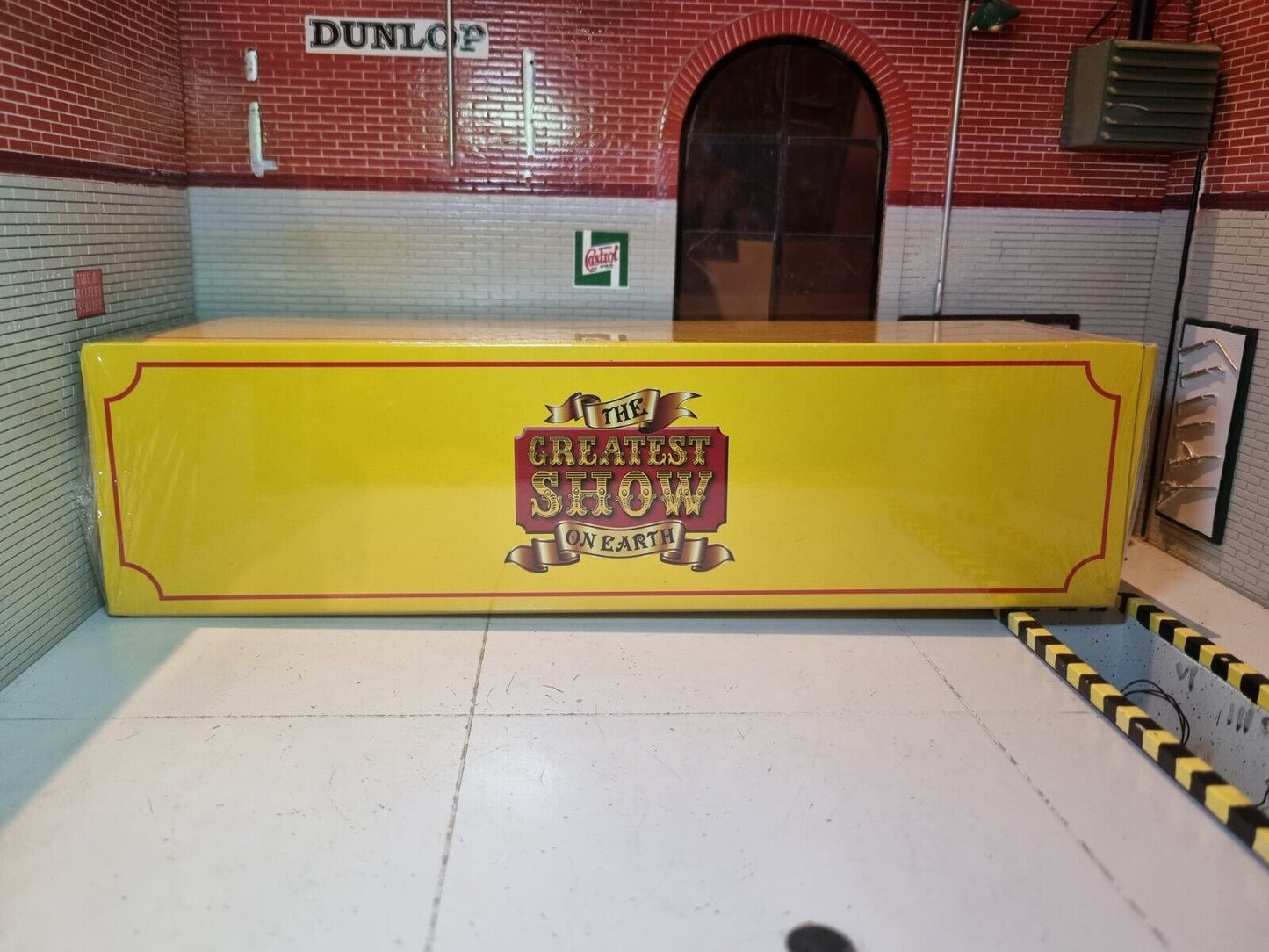 Yellow Box with text reading "The Greatest Show On Earth".