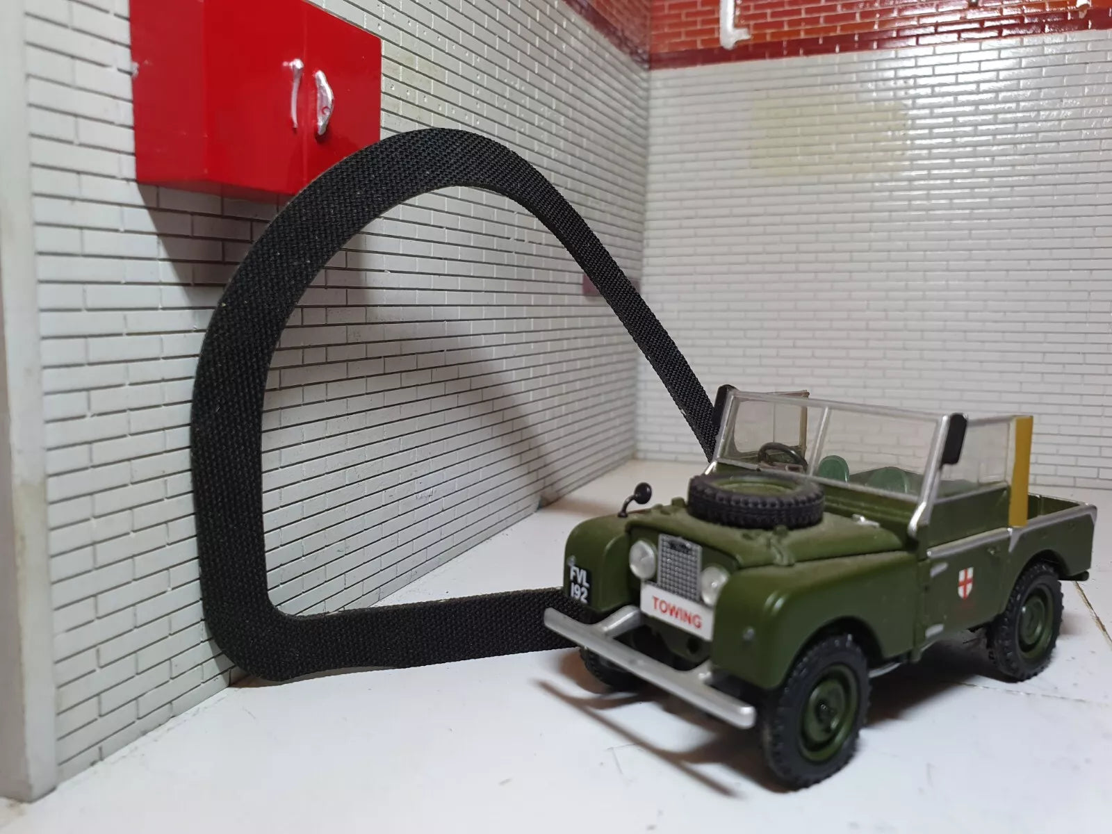 Light Seal with a green model Land Rover Series 1 (for illustration purposes) in the front right corner of the image.