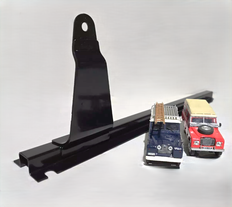 A Land Rover Series Seat Mounting Bracket in Black. To the right are two models of a red and a blue Series vehicle for illustrative purposes.