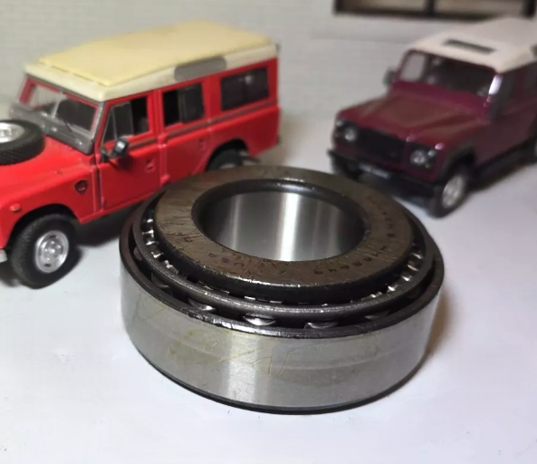 Land Rover Salisbury Axle Differential Pinion Bearing, on the left is a model of a Red Series 3 and one the right a Red Defender