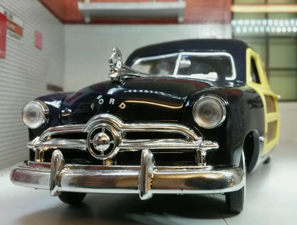 Front view of a 1949 Ford Woody Station Wagon in black.