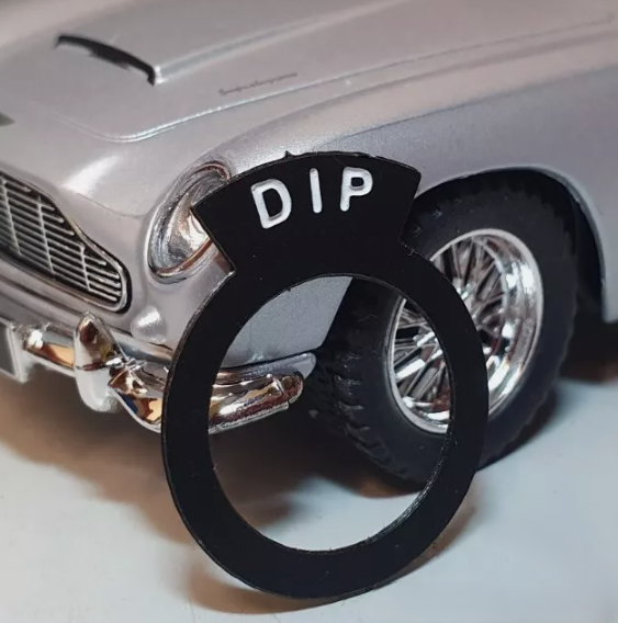 Aston Martin style switch tag reading "DIP".