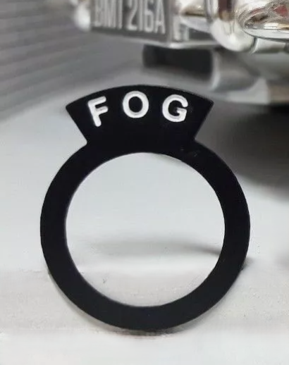Aston Martin style switch tag reading "FOG".