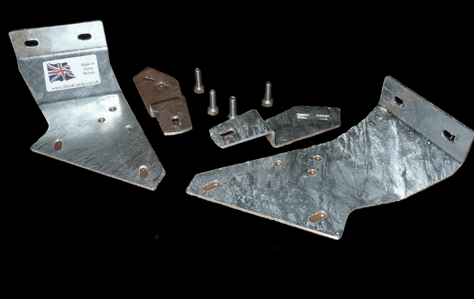 Bits4landys Defender Bulkhead / Inner Wing Bracket set of four galvanised brackets, on a black background shown with x4 bolts in the middle.