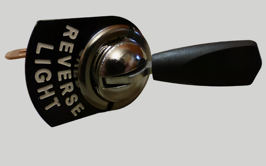 A Lucas toggle switch with a switch tag reading "Reverse Light".