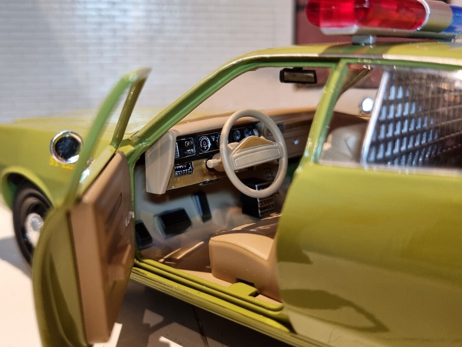 Interior View of A 1:24 Scale Green Plymouth Fury Showing A Brown Interior
