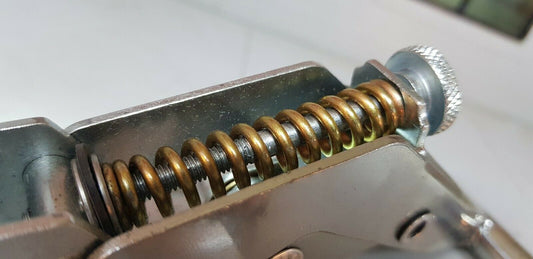 Close up of a Series 1 Vent Adjuster Assembly, focusing on the spring, adjustment screw, and washers/seal.